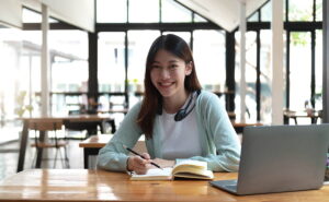 Photo of Asian woman with notebook